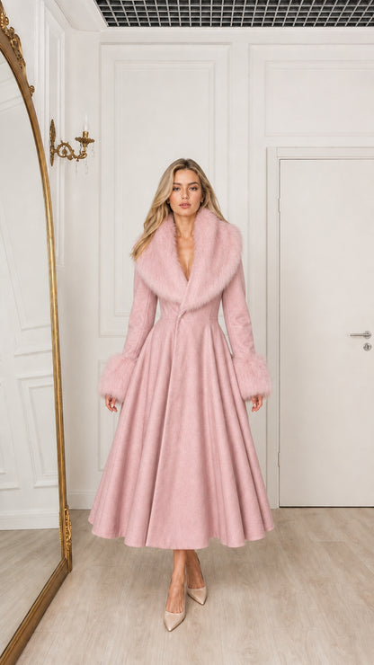 Model wearing dusty pink fit and flare midi overcoat with faux fur collar