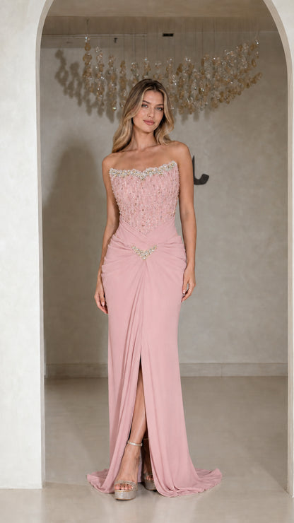Front view of strapless dusty pink beaded corset evening gown with front slit