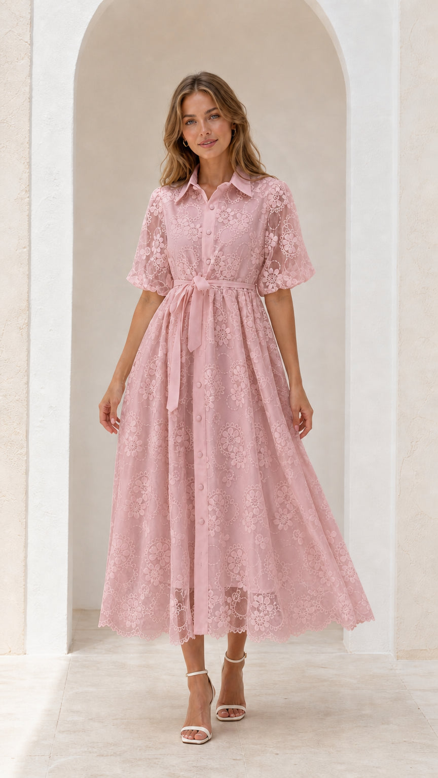 Front view of blush pink embroidered lace midi dress with belt