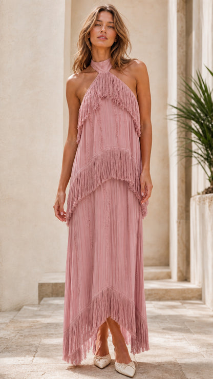 Model wearing dusty rose halter neck tiered fringe maxi dress