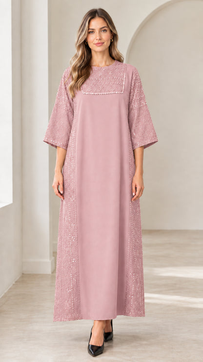 Front view of woman wearing dusty pink sequin embellished maxi dress