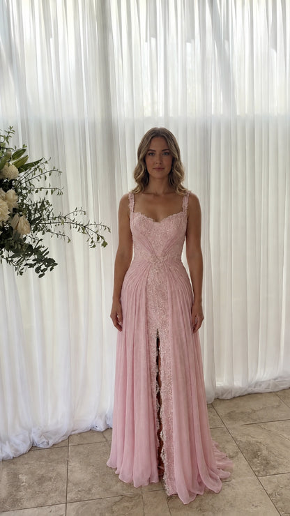 Front view of model wearing blush pink sweetheart neck chiffon evening gown