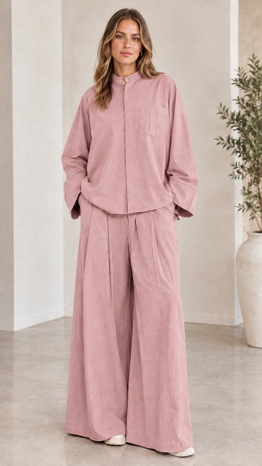 Front view of woman wearing the matching two-piece wide-leg set in dusty pink