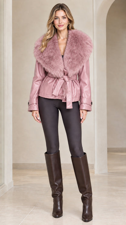 Front view of model wearing dusty pink faux leather jacket with matching pink fur collar