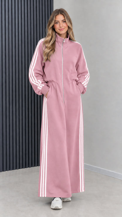 Front view of model wearing dusty pink full-zip striped maxi track dress