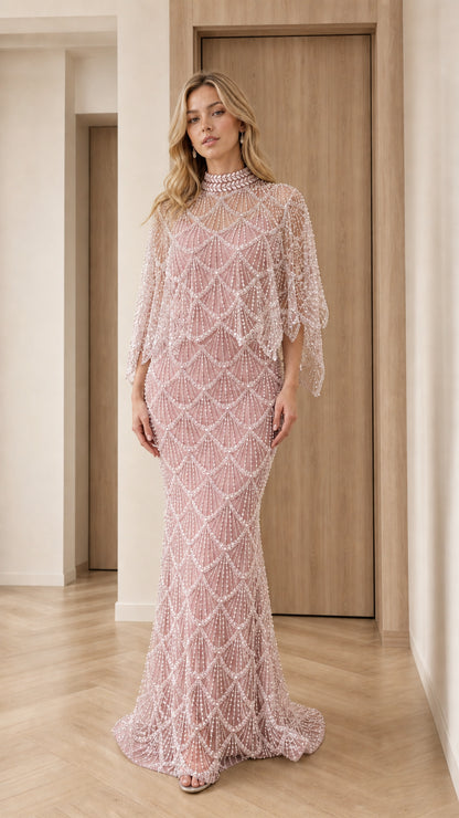 Front view of dusty pink pearl-embellished capelet formal dress