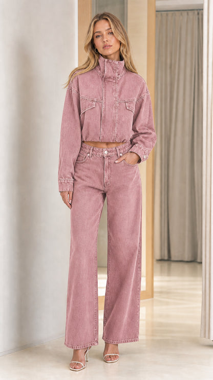 Model wearing dusty rose pink washed cropped denim jacket and wide leg jeans co ord set