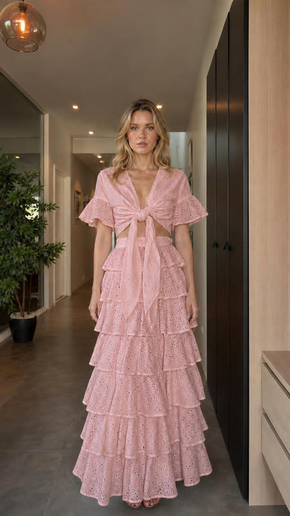 Model wearing pink eyelet embroidered two-piece set