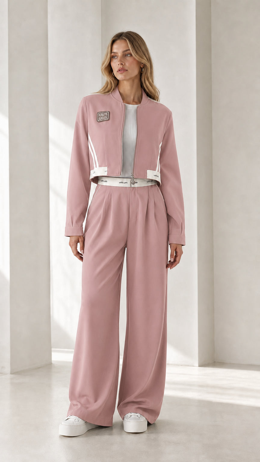 Full view of model wearing dusty pink cropped jacket and wide-leg pants set