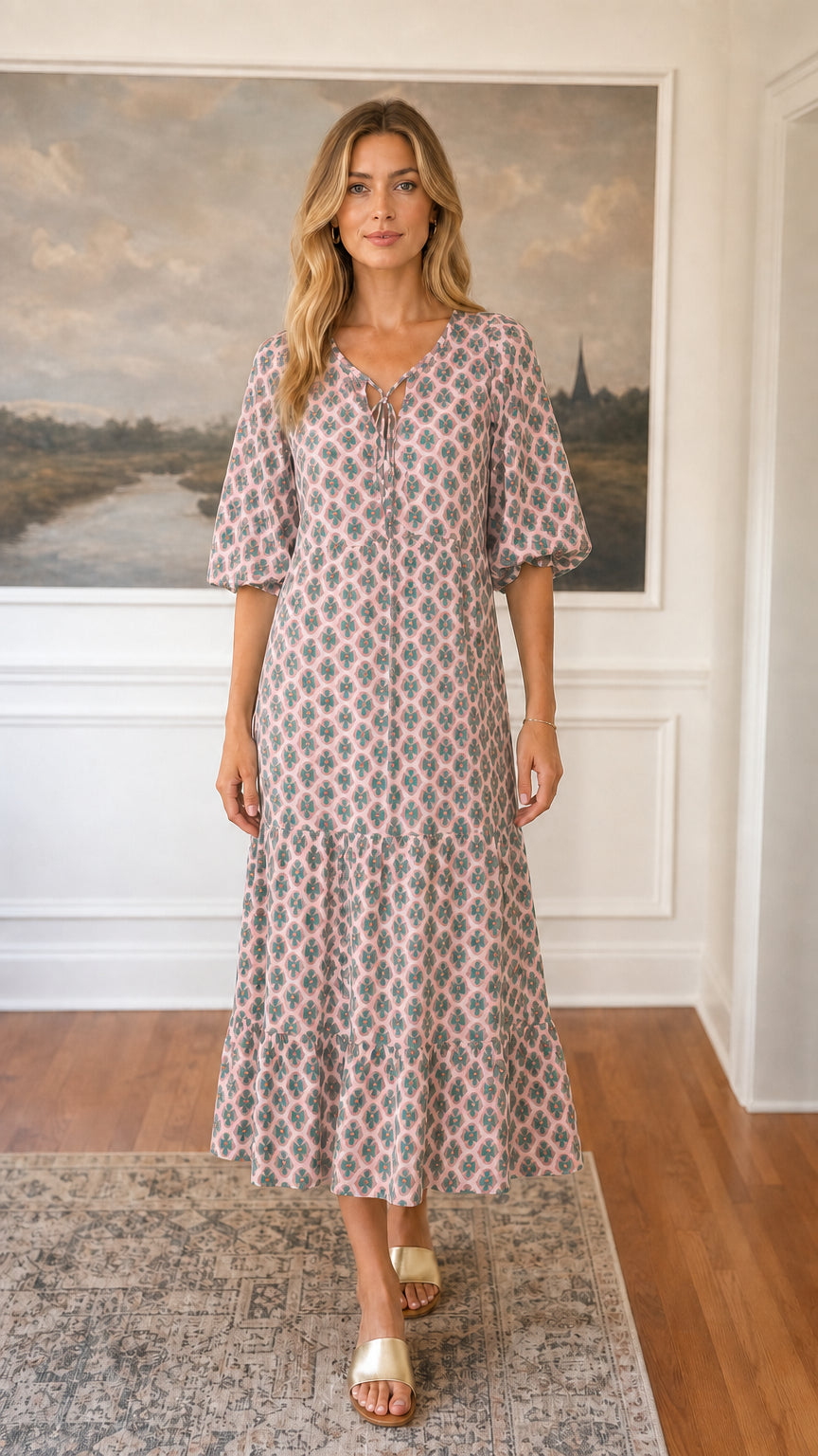 Front view of pink floral tiered midi dress