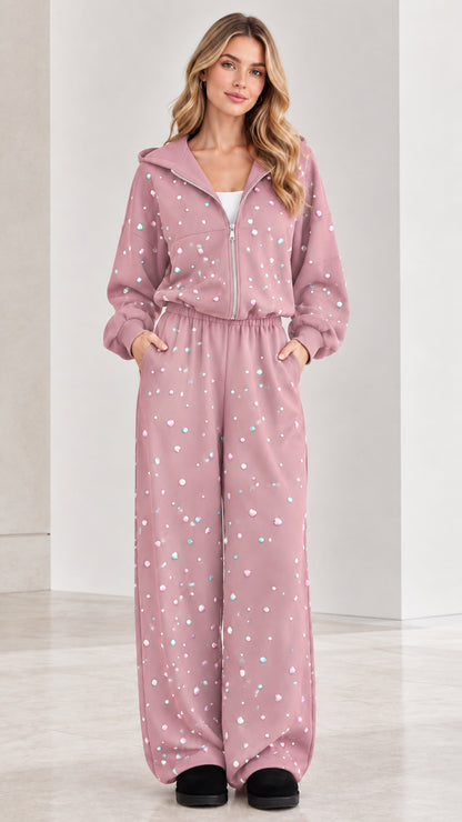 Front view of dusty pink rhinestone zip-up hooded wide leg jumpsuit