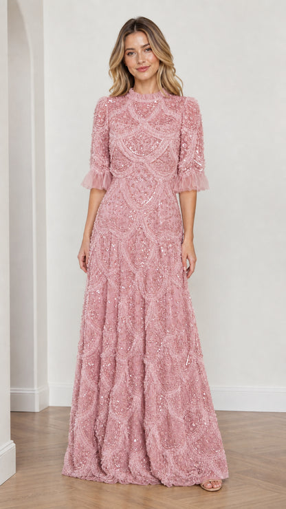 Model wearing Pink embellished ruffle mock neck maxi dress, front view