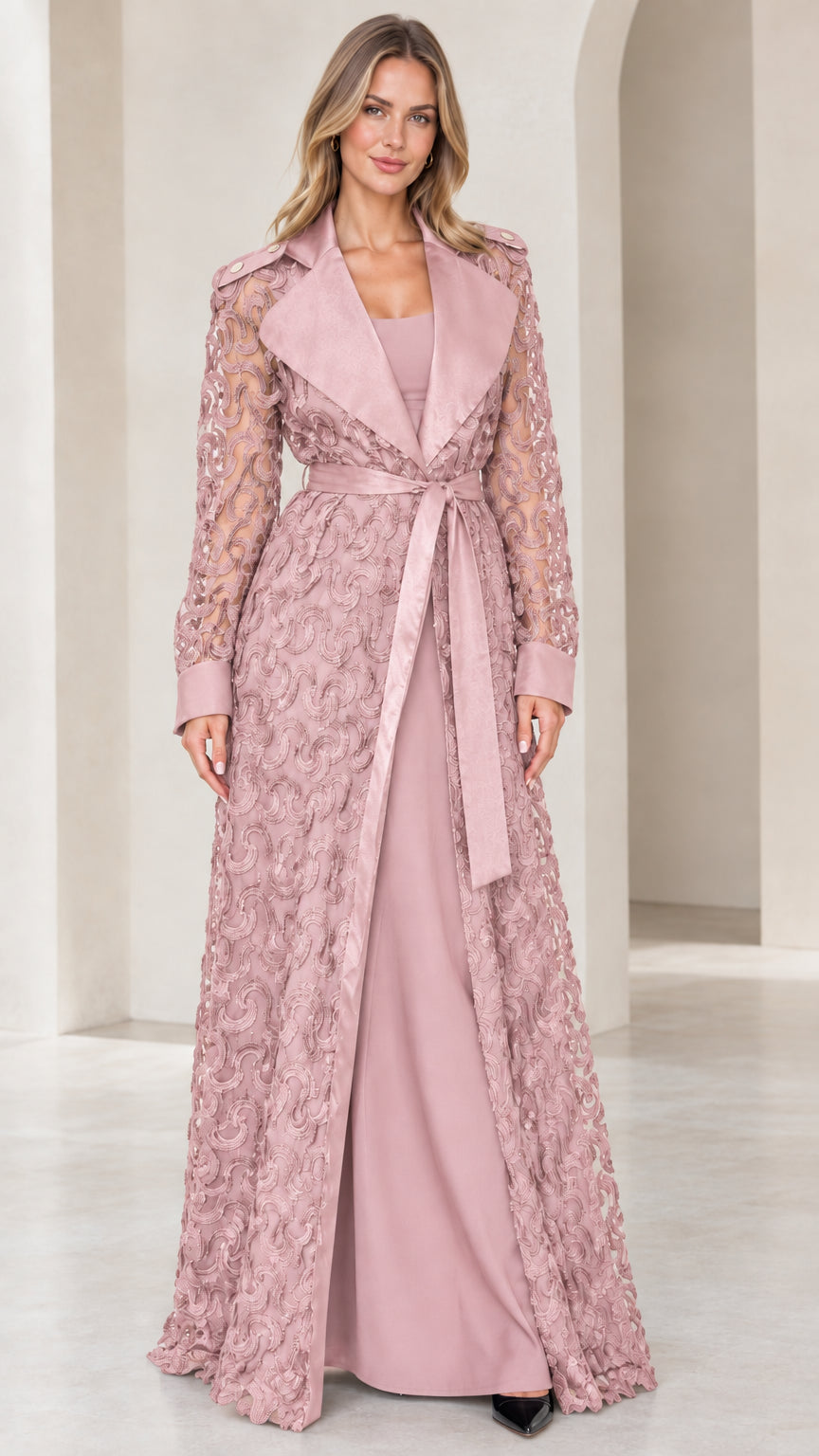 Model wearing dusty pink floral lace maxi trench coat with satin collar