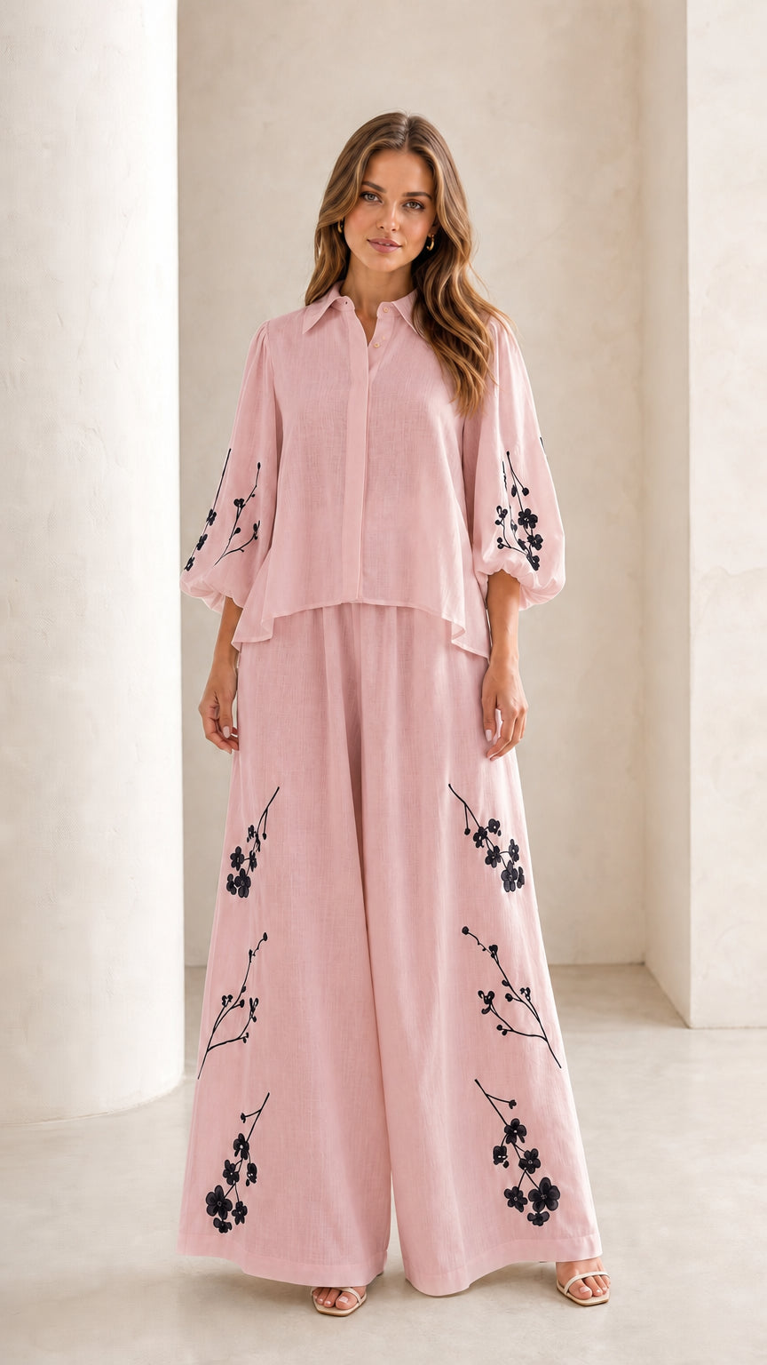 Front view of woman wearing dusty pink floral embroidered two-piece set