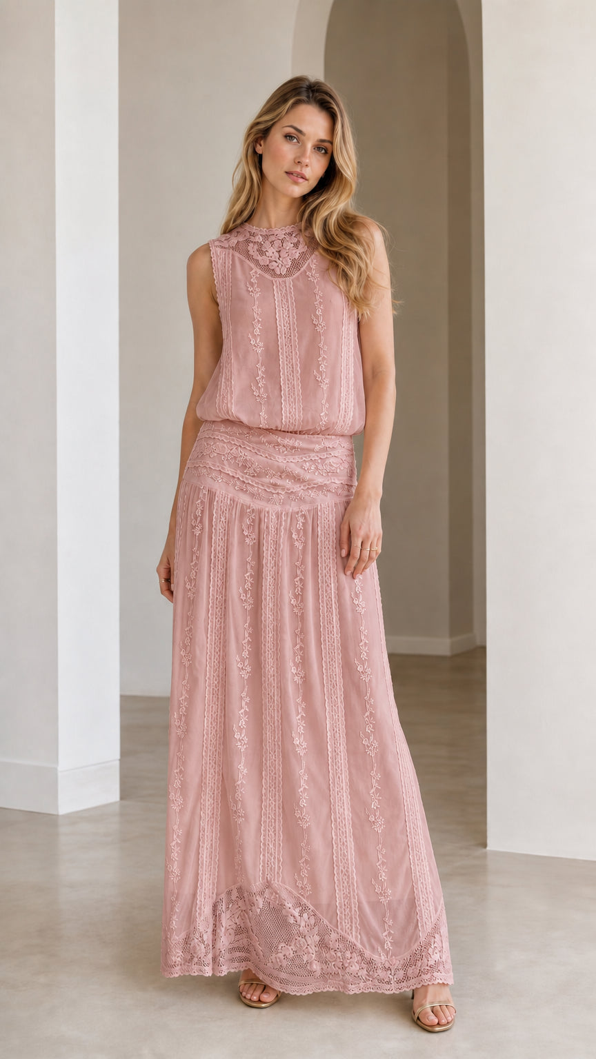 Woman wearing dusty rose embroidered maxi dress