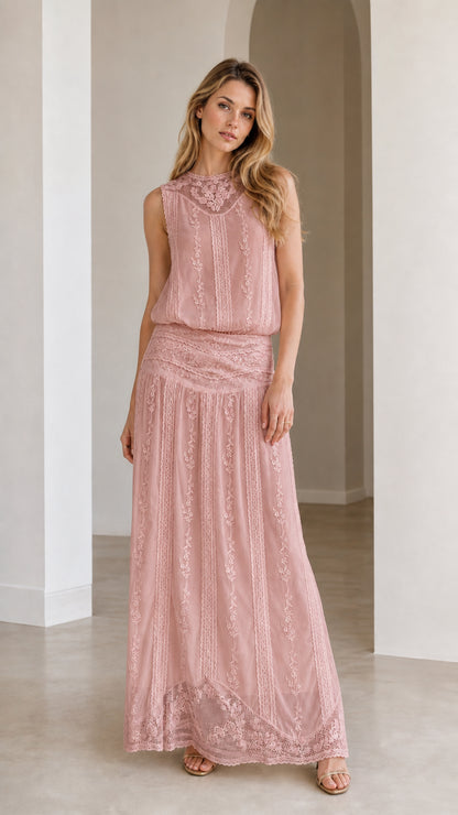 Woman wearing dusty rose embroidered maxi dress