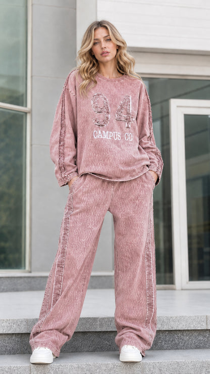Full-length front view of dusty rose pink vintage washed sweatshirt and matching wide leg pants