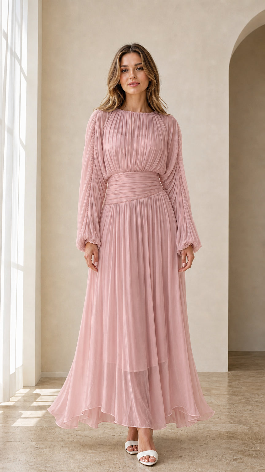 Model wearing dusty pink long sleeve pleated maxi dress