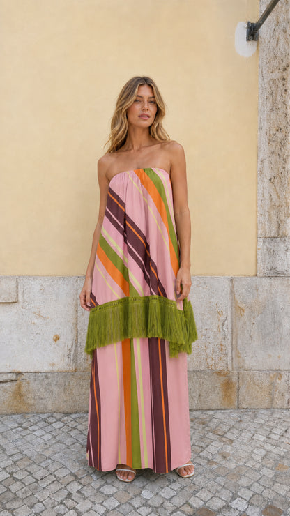Front view of model wearing Pink Multi striped strapless fringe maxi dress