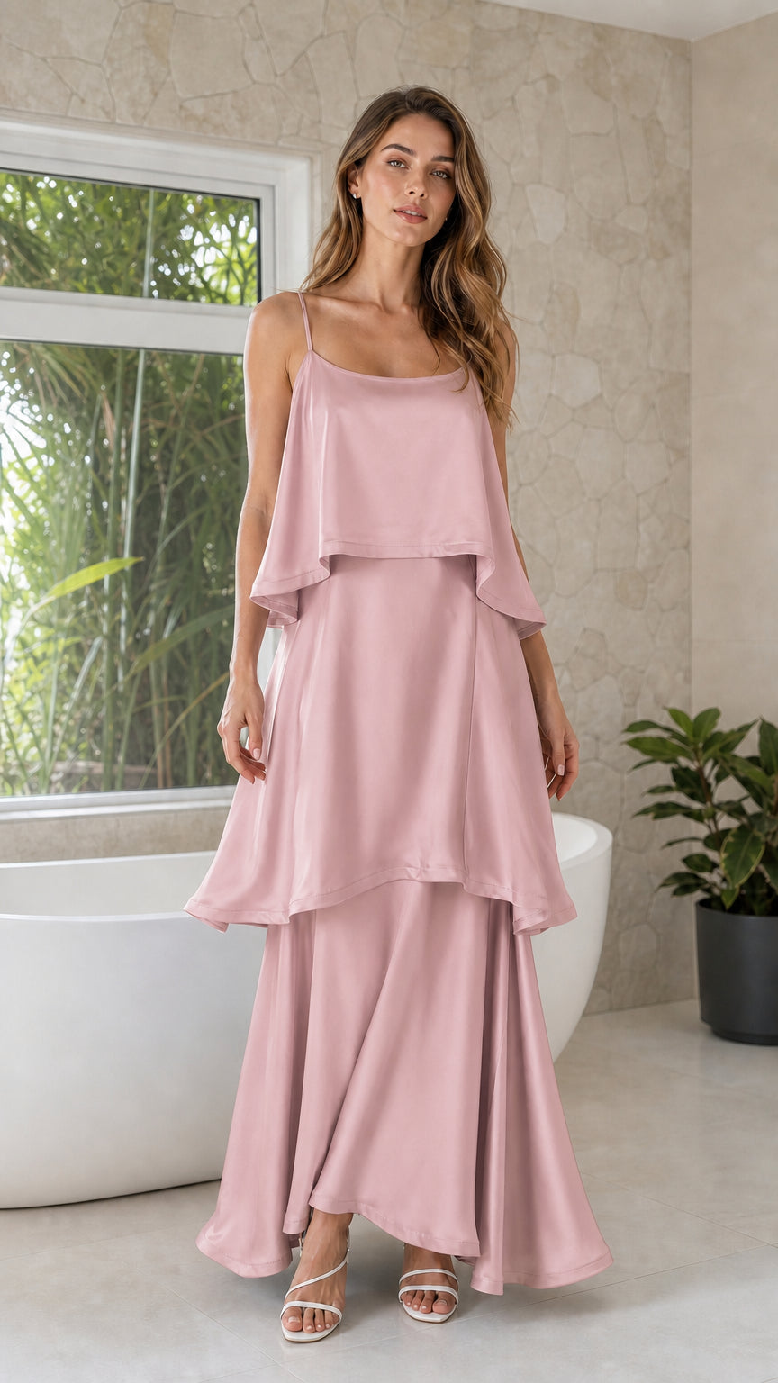 Blush pink tiered silky spaghetti strap maxi dress on model
