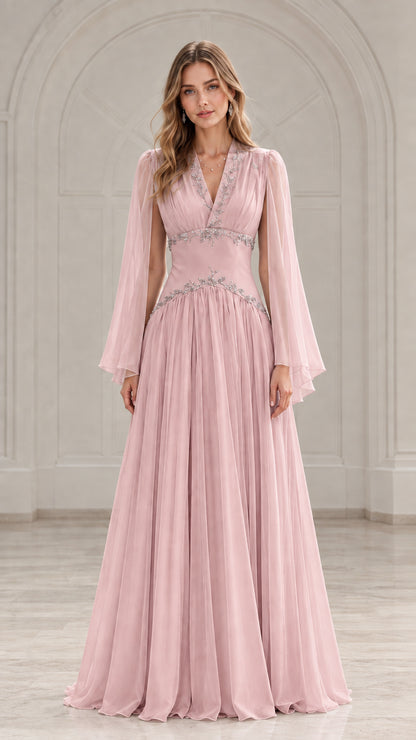 Front view of model wearing a blush pink pleated chiffon evening dress with beading