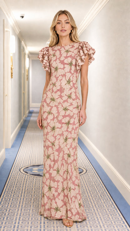 Front view of model wearing dusty pink floral flutter sleeve column maxi dress