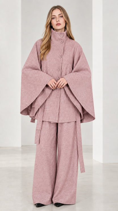 Front view of dusty pink high neck belted cape coat and wide-leg trousers set