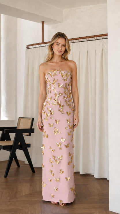 Front view of pink strapless maxi dress with gold butterfly appliques