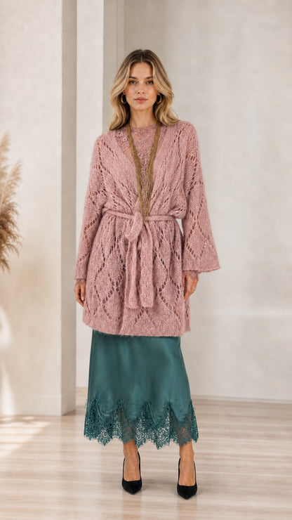 Model wearing pink open front knit cardigan with belt