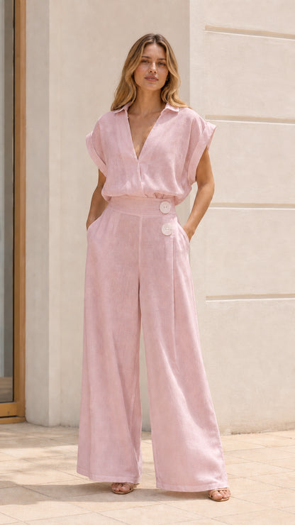 Woman wearing pink wide-leg jumpsuit
