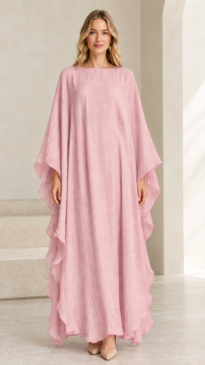 Model wearing dusty pink flowing kaftan maxi dress