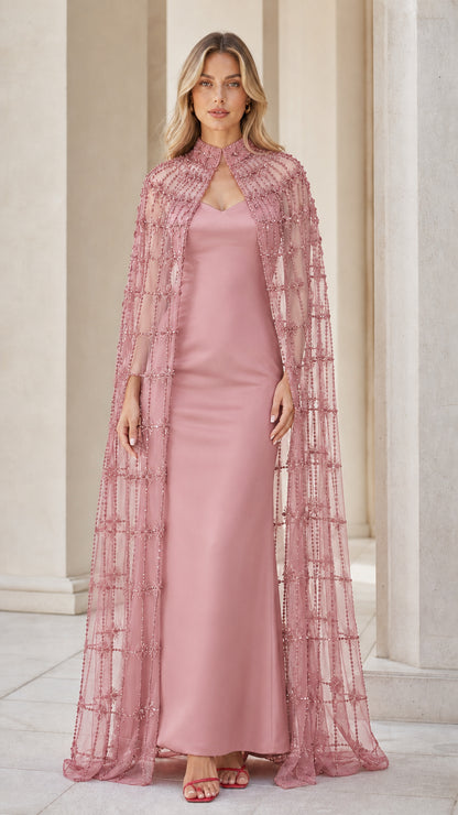 Model wearing pink beaded cape and matching evening gown