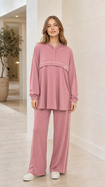 Front view of woman wearing dusty pink 2-piece hooded tunic and wide-leg pants tracksuit set