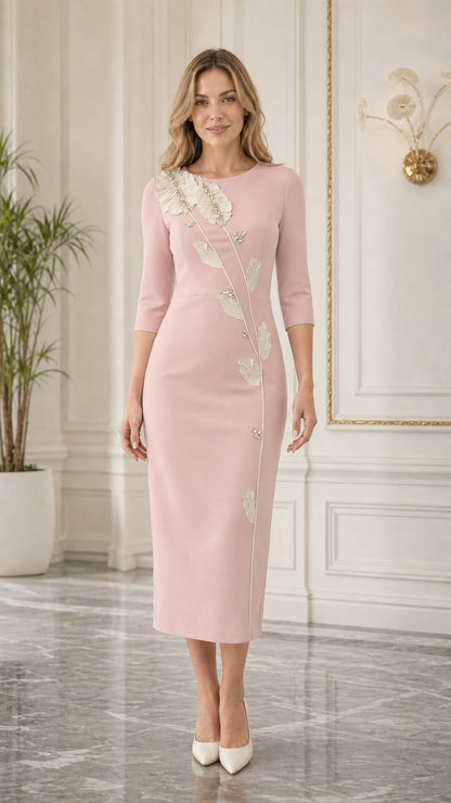 Front view of blush pink midi dress with floral applique