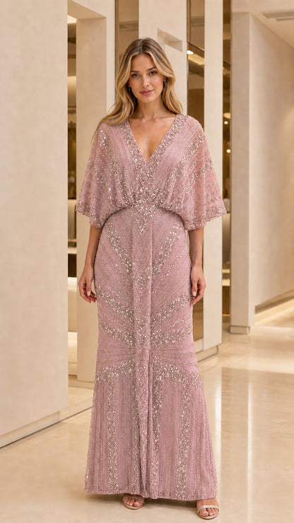 Full length view of woman in dusty pink sequin embellished maxi dress