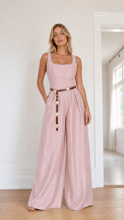 Front view of model wearing pink wide leg jumpsuit