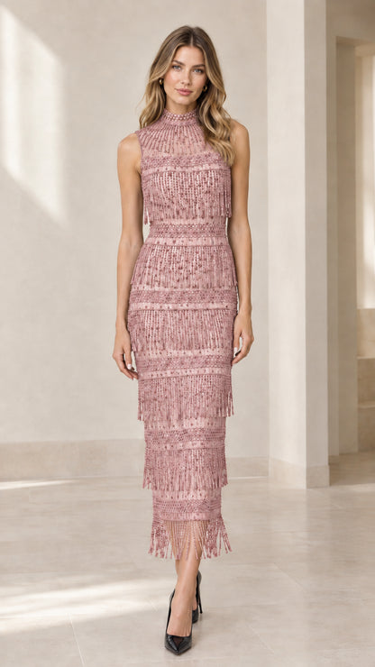 Front view of model wearing dusty pink tiered beaded fringe midi dress