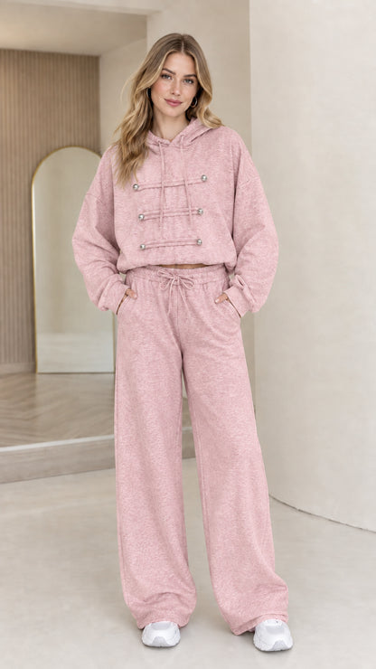 Full-body view of model wearing dusty pink cropped hoodie and wide leg lounge set
