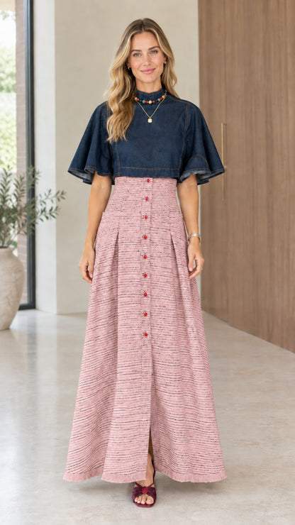 Model wearing dusty pink tweed skirt variant with dark blue flutter sleeve top
