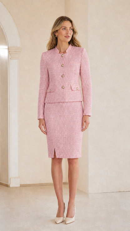 Full-length view of woman wearing pink tweed two-piece skirt suit set