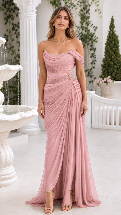 Front view of blush pink draped off-the-shoulder formal gown with butterfly detail