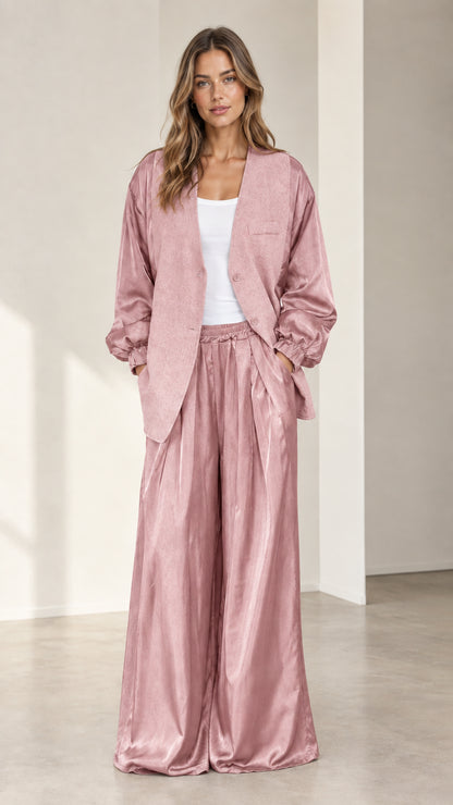 Front view of model wearing dusty pink satin sleeve blazer and matching wide-leg trousers