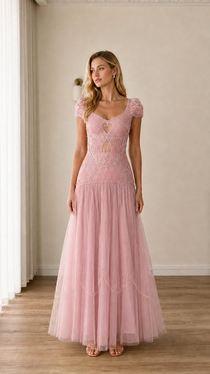 Full-length view of blush pink beaded cap-sleeve cutout tulle evening gown