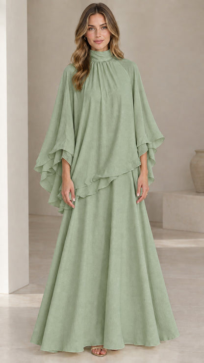 Front full-length view of model wearing sage green high neck capelet maxi dress set