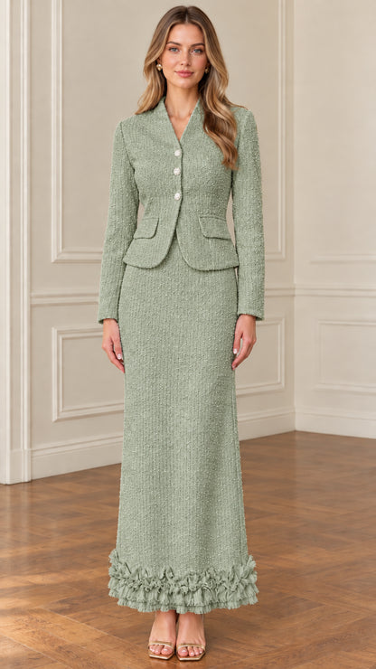 Front view of model wearing sage green tweed jacket and long skirt suit set