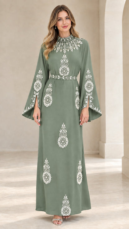 Front view of woman wearing sage green rhinestone embellished maxi dress