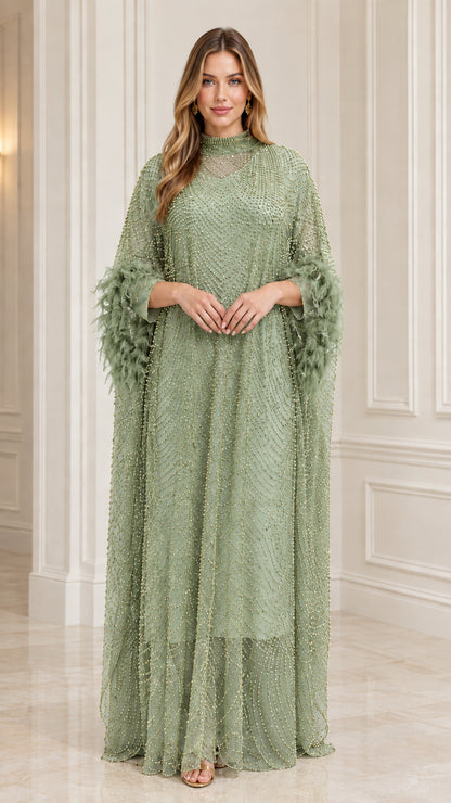 Model wearing Sage Green beaded kaftan evening gown with feather sleeves