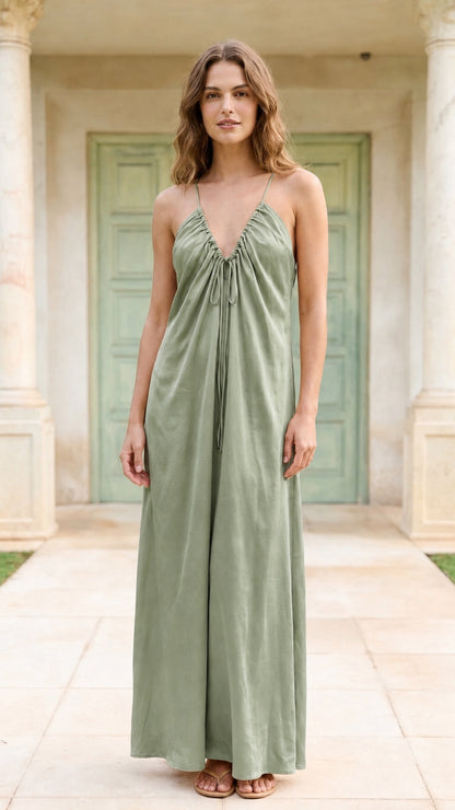 Model wearing sage green spaghetti strap maxi dress