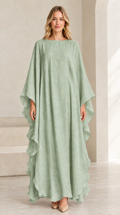Model wearing sage green cape-sleeve kaftan maxi dress