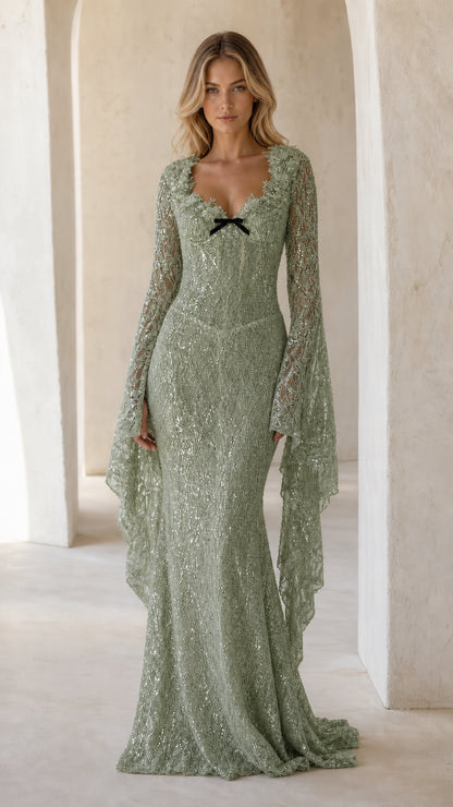 Full front view of sage green sequin mermaid gown with long cape bell sleeves